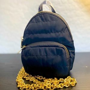 Black mini puffer backpack with gold tone chain straps
